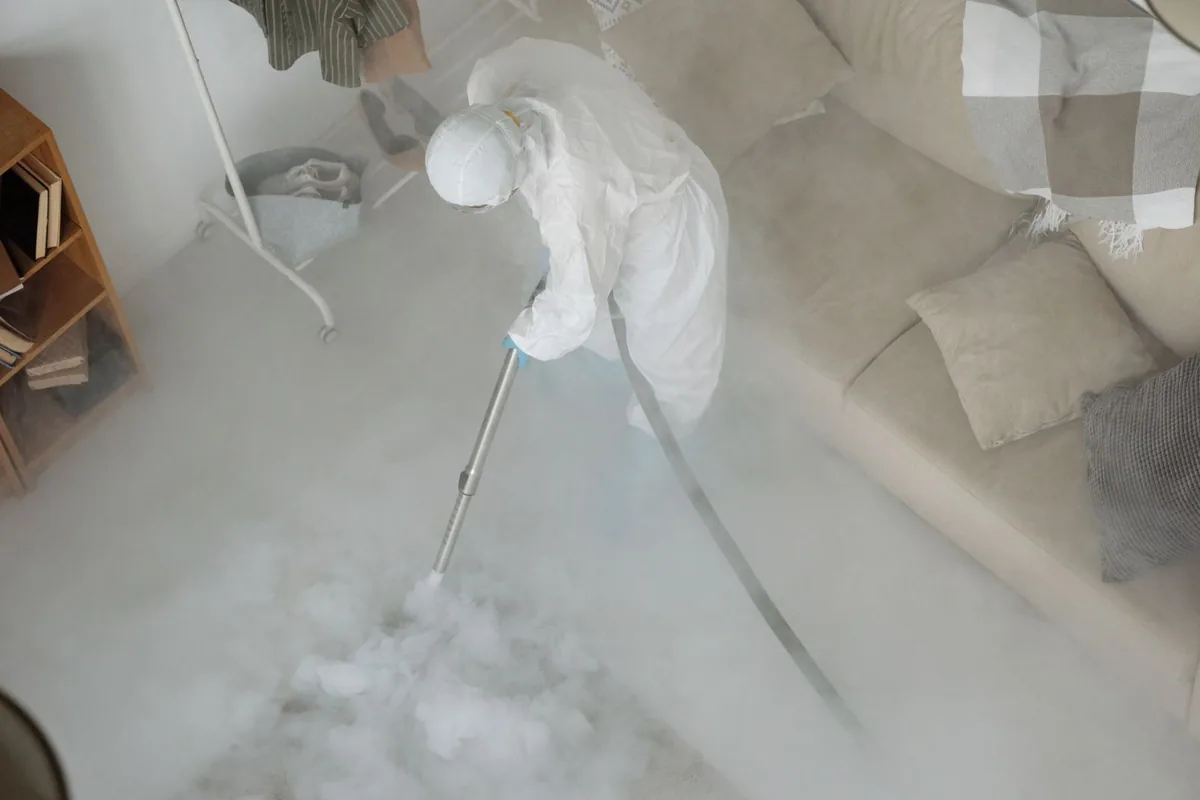 Biohazard cleanup technician in protective equipment, Roseville, OH